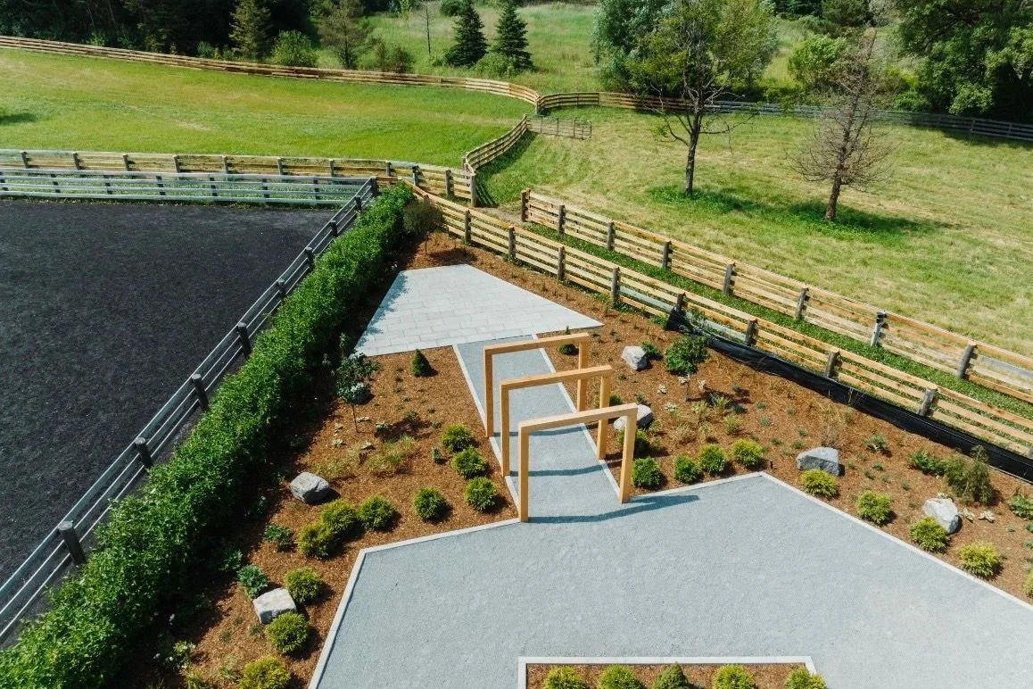 Aerial view of a large rural landscape with geometric paths and new planting